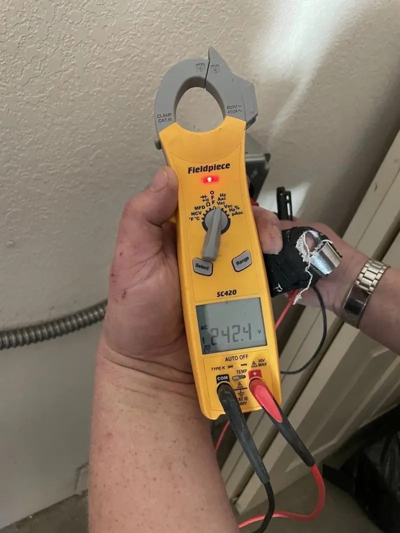 Voltage testing with clamp meter during Generator Installation in Holiday